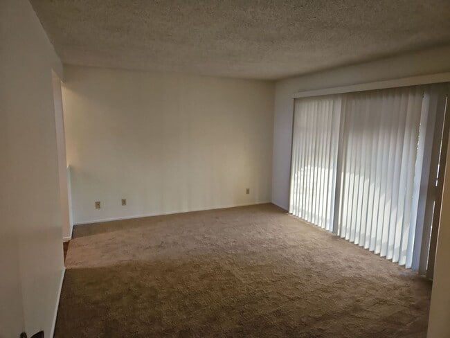 Building Photo - Spacious 4-Bedroom Home with Large Backyard & Covered Patio!