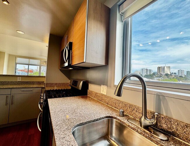 Building Photo - Corner Light. City Energy. Zero Compromise.