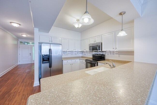 Building Photo - 3 BEDROOM CONDO IN RIVER TOWNE - A GATED LAKEFRONT COMMUNITY!!