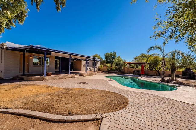 Building Photo - Hacienda-Style Gem with Pool – Spacious 3-...