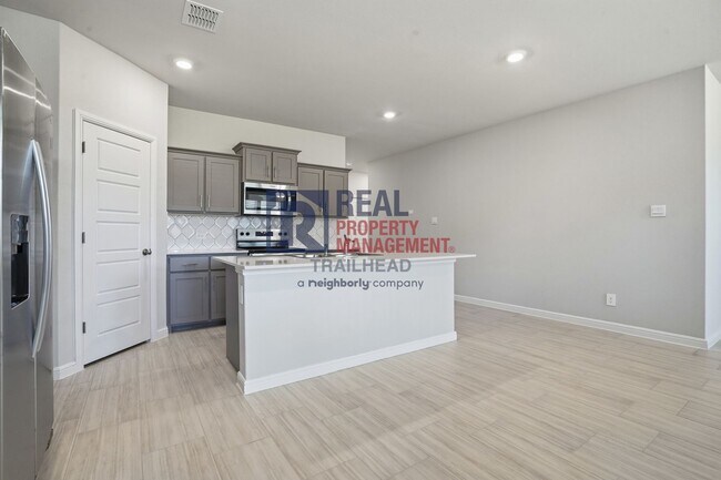 Building Photo - Inviting 4-Bedroom Layout with Flexible Living Areas