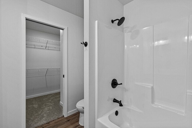 Building Photo - New 3 Bed Townhome with Covered Deck and Oversized Garage!