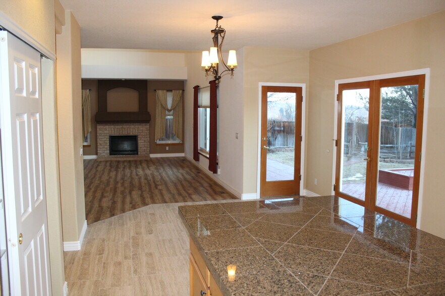 Kitchen – sunny/bright, large granite island, french doors to large deck - 2720 South Cole Court