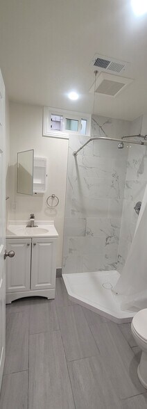 Bathroom 1: off hallway, low step-in shower, whisper quiet exhaust fan - 646 10th Ave