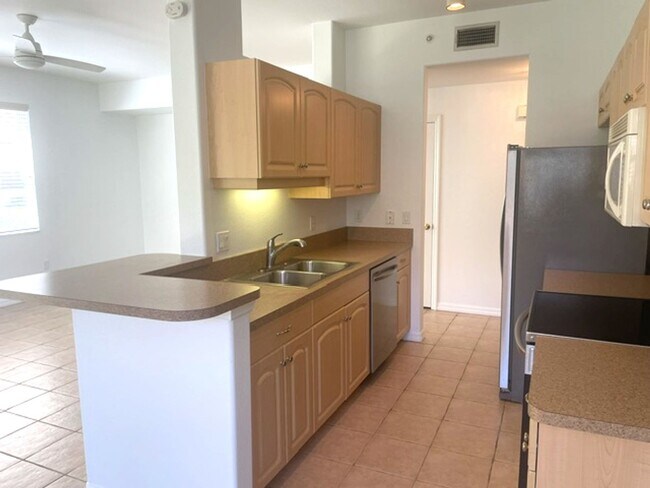 Building Photo - Elegant 3 Bedroom End-Unit Condo with Screened Lanai & Pond Views and A Private Garage