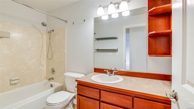 Building Photo - Light filled top floor condo.
