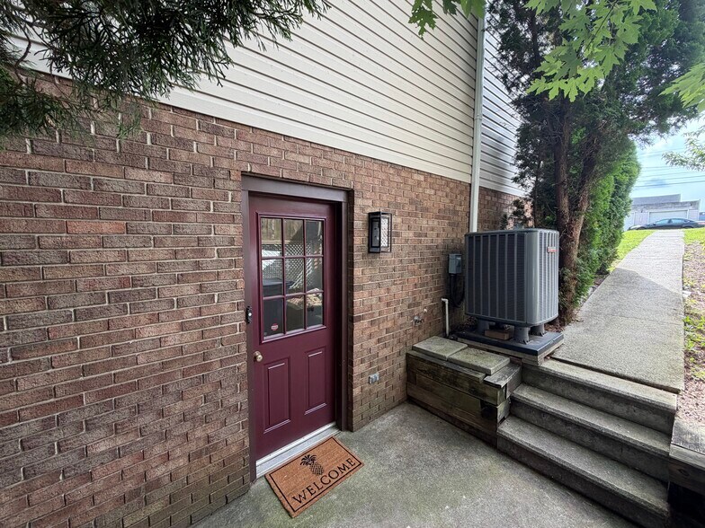 Side entrance with newly painted door and new dusk to dawn light - 917 Rose Hill Ave