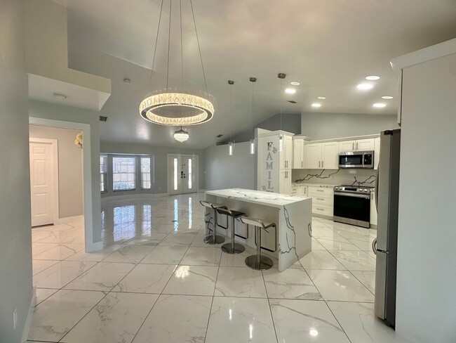 Building Photo - Stunning 3 Bedroom + Den Home with Fence +...