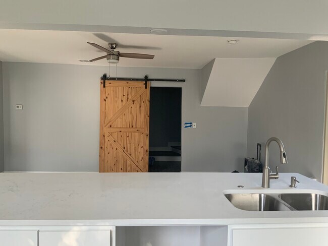 Kitchen looking into hallway leading up to stairs - 3816 Byers Ave
