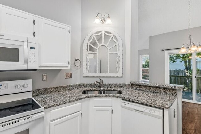 Building Photo - NW - Updated Home with Granite Counter-tops, Fire Place, Deck, Storage Building, Garage!