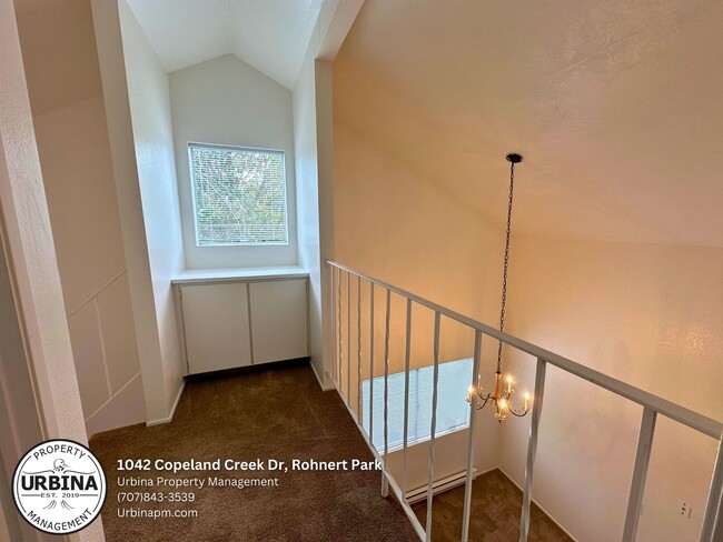 Building Photo - Charming 2-Bed, 1.5-Bath End-Unit Condo in...