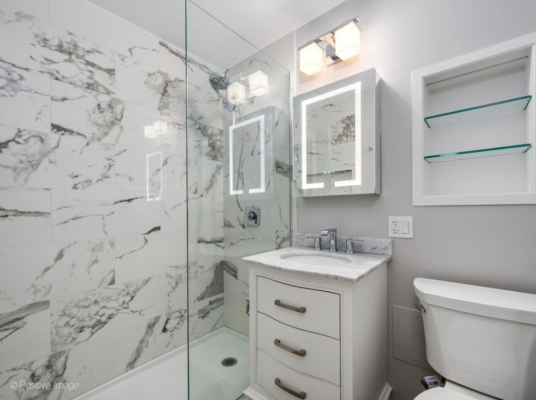 Porcelain, marble and chrome with heated mirror med. cabinet - 3100 N Lake Shore Dr