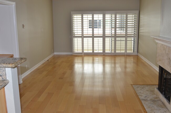 Living Room with Plantation Shutters overlooking pool - 521 Montana Ave