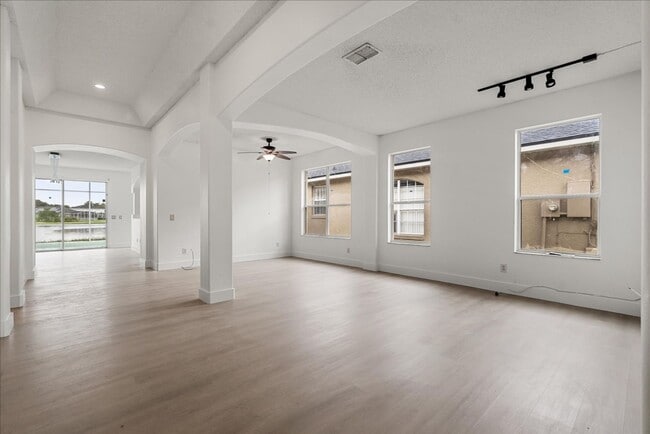 Building Photo - Stunning 4-Bedroom Lakefront Pool Home in Bridgeview at Meadow Woods