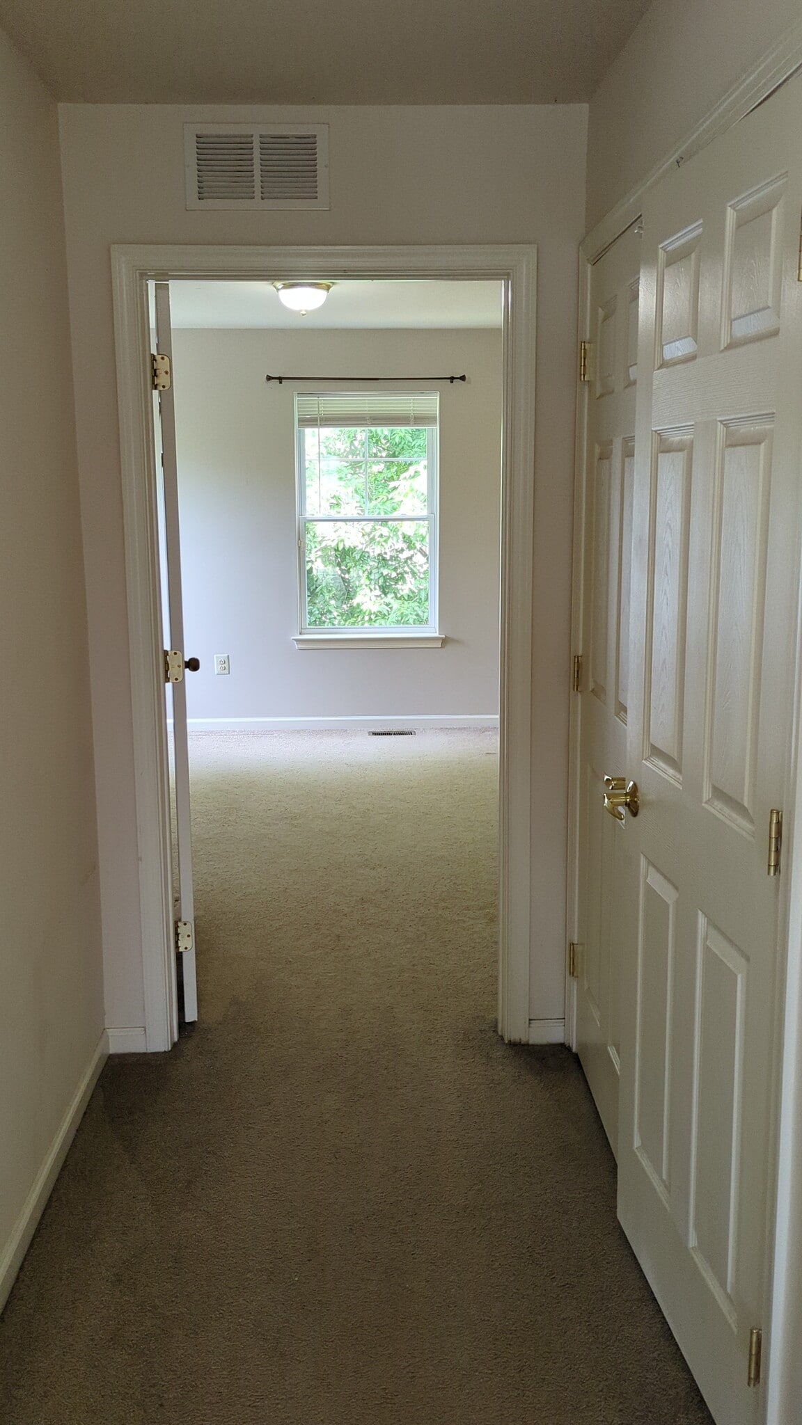 Upstairs bedroom #3 ahead (laundry on the right) - 631 N 44th St