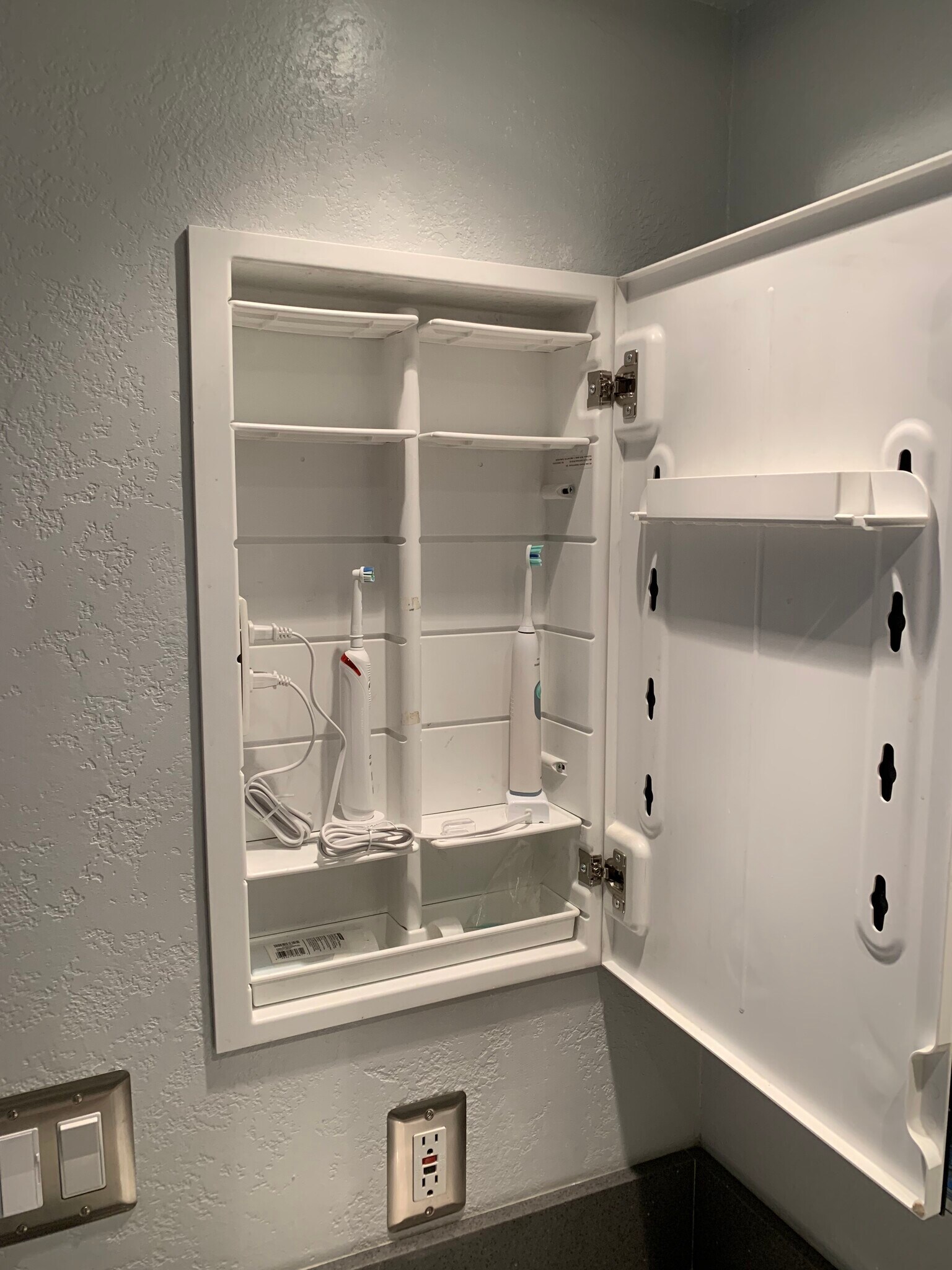 Bathroom storage with outlet - 4062 Georgia St