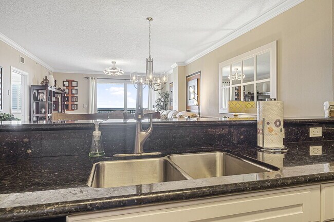 Building Photo - Available for a 7-12 month lease, Unit 208 has a beautiful oceanfront setting.