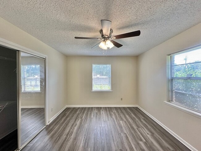 Building Photo - Spacious 4-Bedroom Home on a Corner Lot wi...