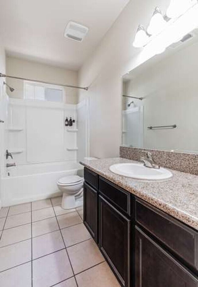 Building Photo - Four bedroom/2-bath home with 2-car garage