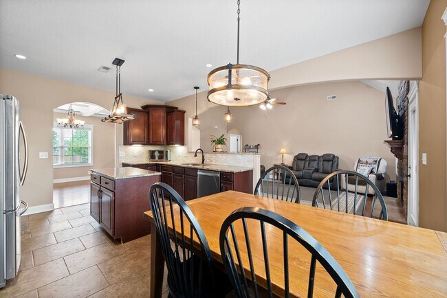 Building Photo - Spacious 4-Bedroom Home with Dual Living A...