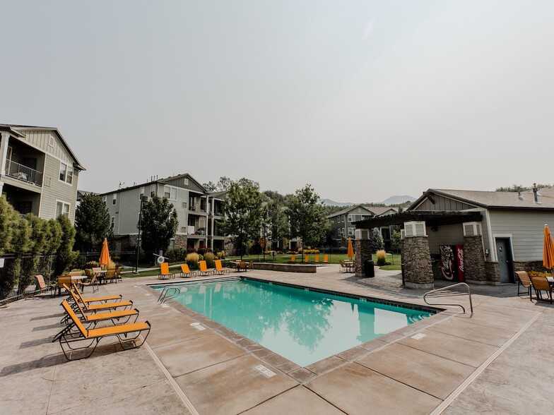 Lounge Chairs by Pool - Falls at Riverwoods Apartments and Townhomes