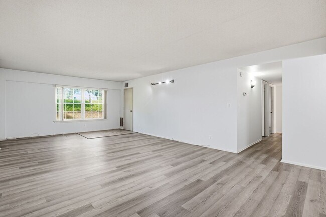 Building Photo - This expansive ground level residence is set within a serene, gated garden community surrounded b...