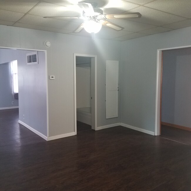 Dining room looking at living room, bathroom, and hallway - 1201 E Walnut St