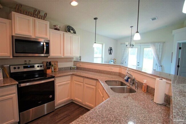 Building Photo - Popular Floor Plan, Almost New Home in Woo...