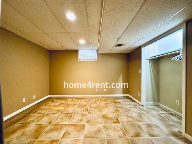 Building Photo - A Lovely Lenexa Home w/ Wood Floors Throughout, Updated Kitchen, Finished Basement and a Fenced Y...