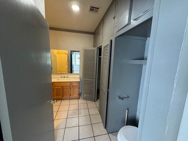 Building Photo - Three bedroom two bath home with central heat and air, large fenced backyard, and carport!