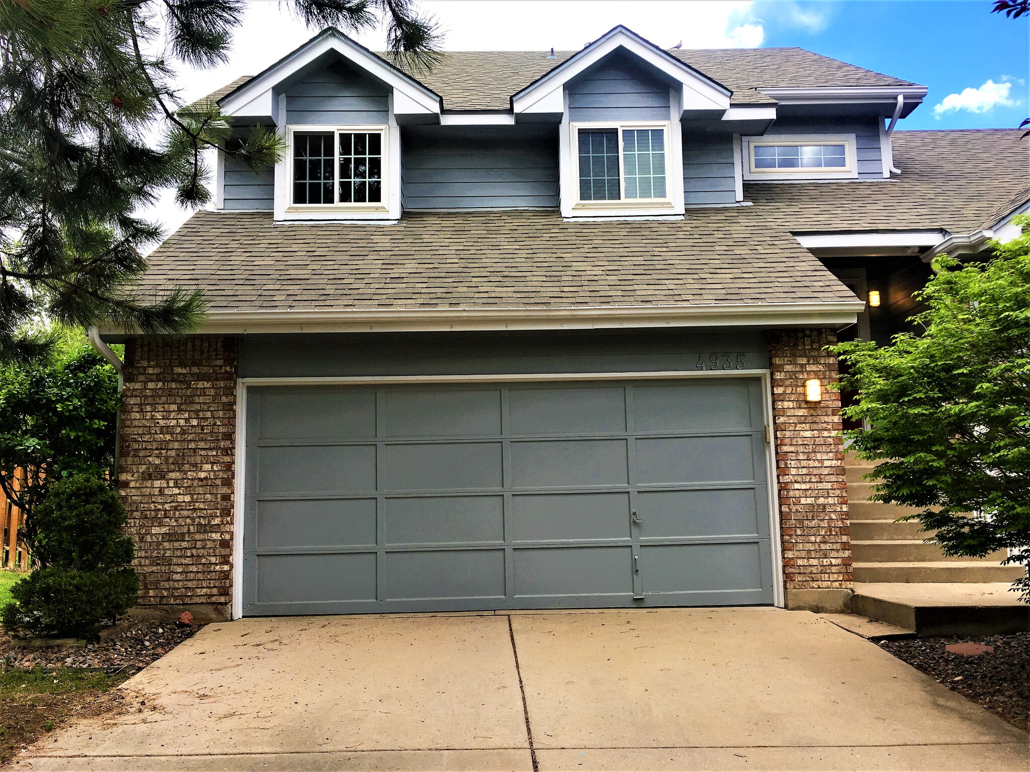 Two car garage, with remote opener. - 4935 Granby Cir