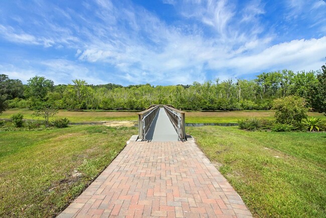 Building Photo - Stunning 4/3 in Gated Dora Parc! Water Views!
