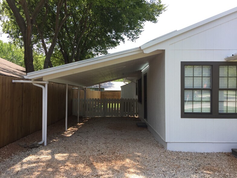 Carport with gate to back yard - 310 East 3rd St.
