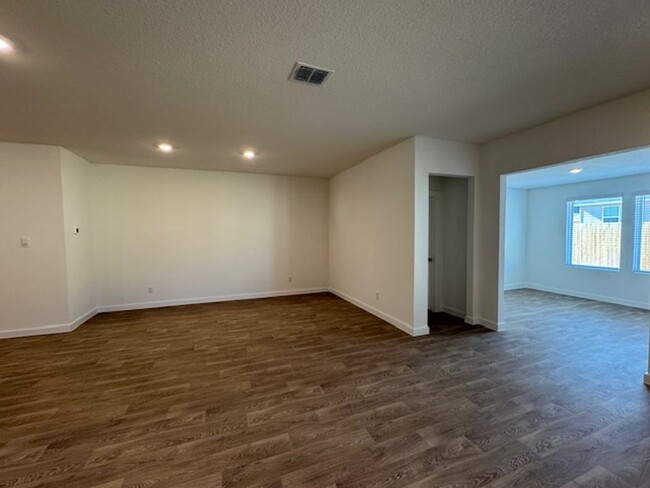 Building Photo - BRAND NEW 4 BR / 2 BA with THREE-CAR GARAG...