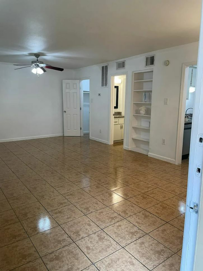 studio living brown floor.JPG - Forest Oaks Apartments