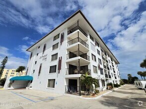 Building Photo - Coastal Paradise Awaits: Elegant 2-Bed, 2-...