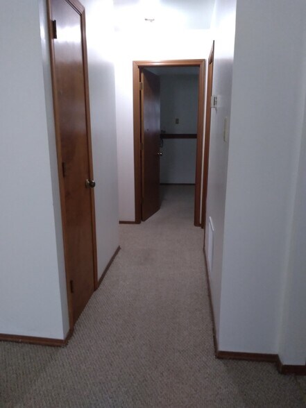 Hallway to bedroom with storage closet on left - 626 N Elmer St