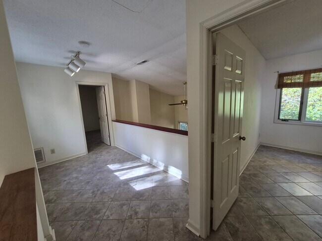 upstairs with master bedroom, office (3rd bedroom) and view of loft - 4422 Beechnut Ln