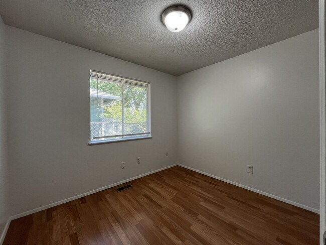 Building Photo - Charming Ranch Home with Sunroom or 4th Bedroom, Two-Car Garage and Fenced Backyard