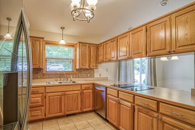 Building Photo - This beautiful home is located in a quiet private neighborhood and perfect for a serene living at...