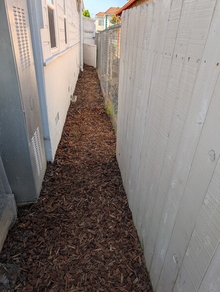 Fresh wood chips line the north side of the property - 4828 Sawtelle Blvd