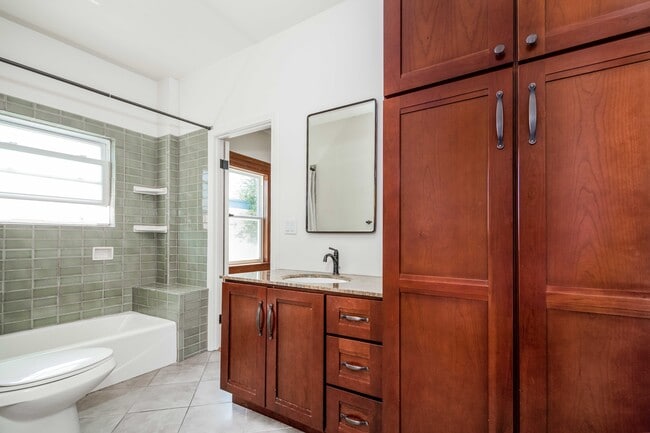 Bathroom with soaking tub / shower and linen closet. - 431 Athol Ave