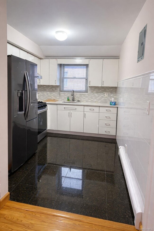 Building Photo - 214-27 38th Ave