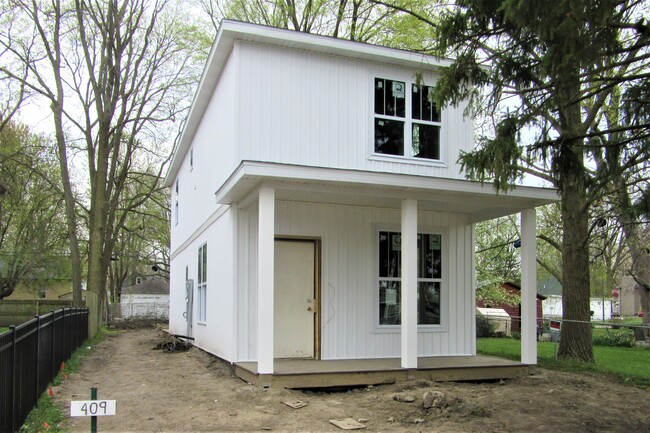 temporary front door to be replaced in a week - 409 W Maple St