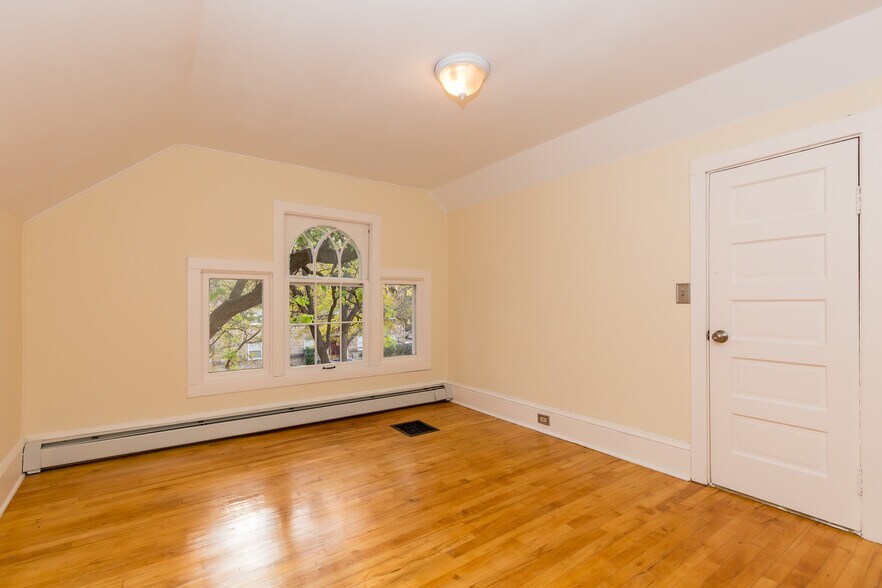 Bedroom #4 Upstairs with decorative street facing window - 715 5th St SE