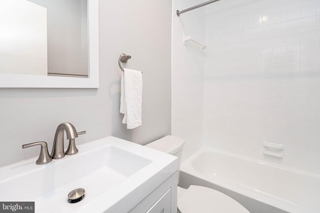 Updated bath with gleaming tile. - 2012 O St NW