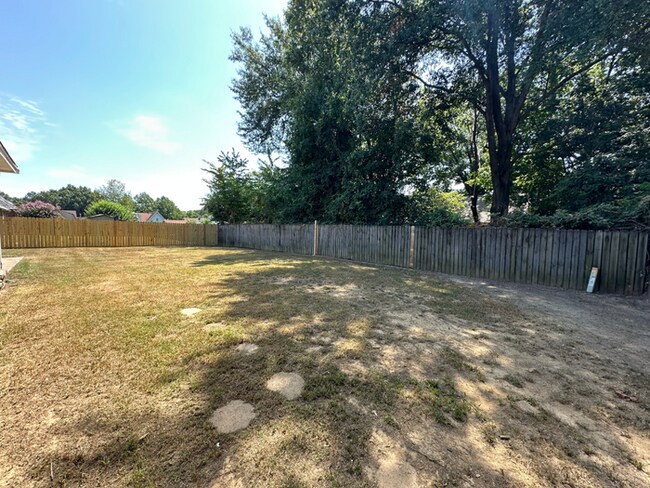 Building Photo - Grand 4BR/2BA Near Southwind | 2,438 Sq Ft, Stone Fireplace, Soaking Tub & 2-Car Garage
