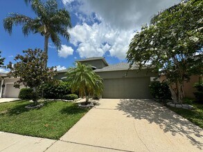 Building Photo - Beautiful 3/2 home near Lake Nona ~ Fenced In Yard ~ LVP & Tile Flooring ~ Community Pool!