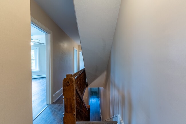 Hallway when you first come up the stairs from entrance hallway. Looks into the living room. - 506 Washington St