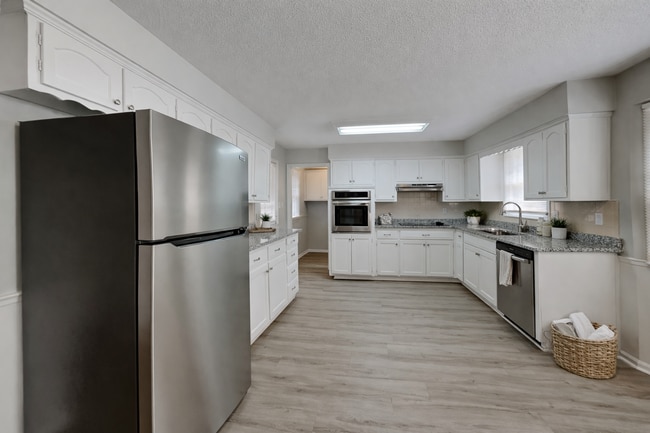 Building Photo - Spacious 4BR Home with Finished Basement, Fireplace & Unique Layout